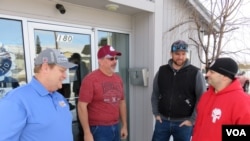 Alcoa smelter workers commiserate at their union hall in East Wenatchee, Washington; from left Kelley Woodard, Kirk Peterson, Clayton Verellen and Chris Morales, Jan. 20, 2016. (T. Banse/VOA)