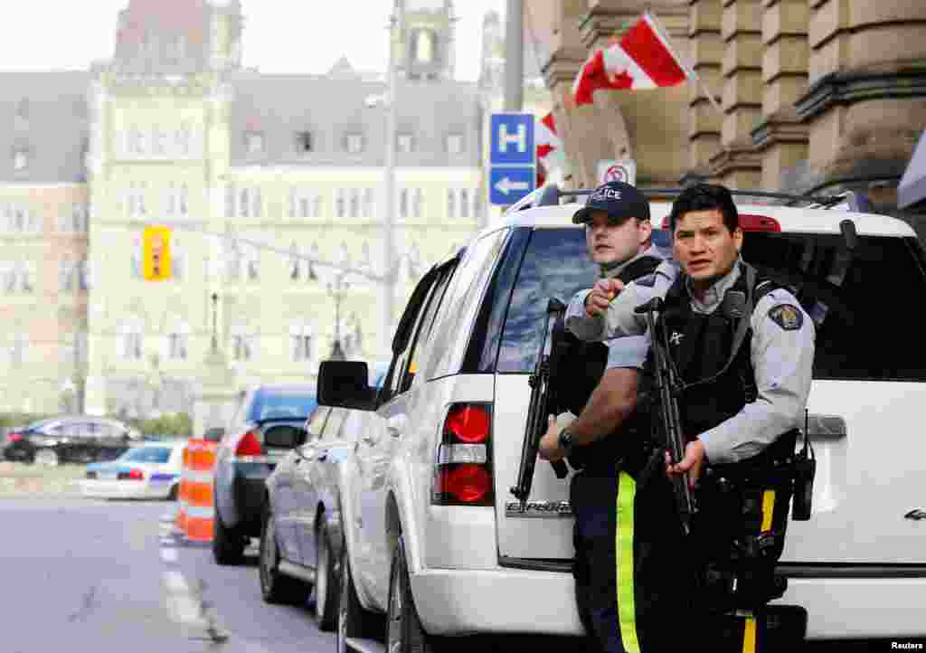 ကနေဒါလွှတ်တော်ကို လုံခြုံရေးအရ ပိတ်ထားလိုက်ပြီးနောက် အနီးတဝိုက်မှာ လက်နက်အပြည့်အစုံနဲ့ ကနေဒါ လုံခြုံရေးတပ်ဖွဲ့တွေ နေရာယူထား 