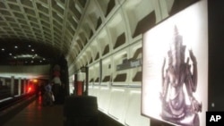 On the metro platform, in Washington DC, a billboard highlights the “Gods of Angkor” exhibit.