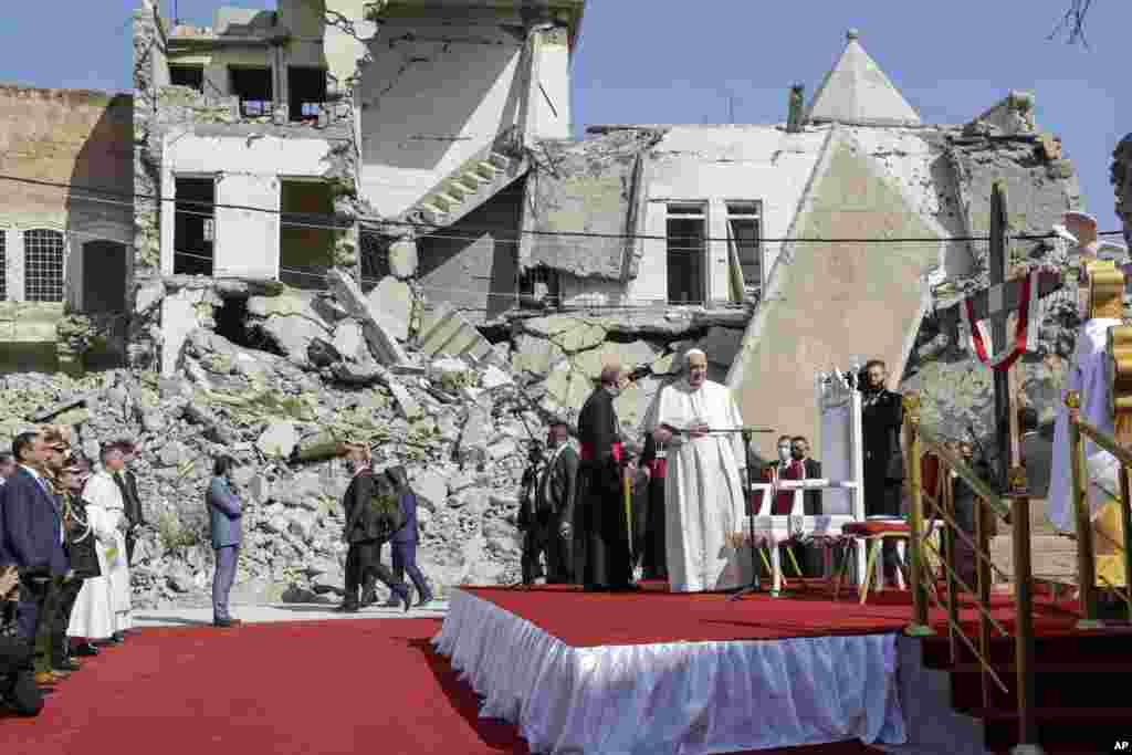 Pope Francis arrives to pray for the victims of war at Hosh al-Bieaa Church Square, in Mosul, Iraq.