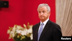 FILE - Chile's Finance Minister Felipe Larrain attends to a meeting at La Moneda Presidential Palace in Santiago, Chile, March 21, 2018.