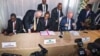 FILE - Edem Kodjo, center, a former chairman of the Organization of African Unity, sits with diplomats during the opening of a Congolese political dialogue in the Democratic Republic of Congo's capital, Kinshasa, Sept. 1, 2016.