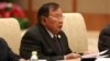 FILE - Laos' President Bounnhang Vorachith speaks with Chinese President Xi Jinping (not pictured) during a bilateral meeting at Diaoyutai State Guesthouse in Beijing, China.