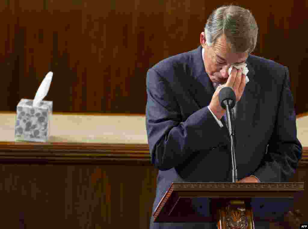 Outgoing Speaker of the House John Boehner, Republican of Ohio, wipes his eyes as he gives a farewell speech from the House floor at the U.S. Capitol in Washington, D.C. Paul Ryan, Republican of Wisconsin, becomes the new Speaker.