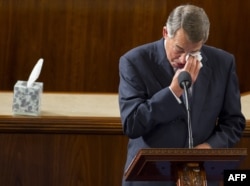FILE - Outgoing Speaker of the House John Boehner, Republican of Ohio, wipes his eyes as he gives a farewell speech from the House floor at the U.S. Capitol in Washington, Oct. 29, 2015.