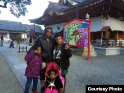 Khiana Robinson, far right, with her family in Japan. Pictured: Leonard Robinson, center, with their daughters Anaya, left, and Naima, right. (An earlier version mistakenly stated the picture was taken in South Korea.)