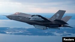 The U.S. Marine Corps version of Lockheed Martin's F-35 Joint Strike Fighter flies over the Atlantic test range at Patuxent River Naval Air Systems Command in Maryland in a Feb. 22, 2012 photo.