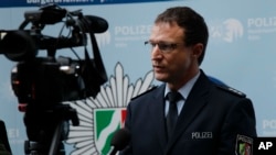 Police spokesman Christoph Gilles speaks during an interview with The Associated Press in Cologne, Germany, Wednesday, Jan. 6, 2016. More women have come forward alleging they were sexually assaulted and robbed during New Year’s celebrations in the German city of Cologne, as police faced mounting criticism for their handling of the incident.