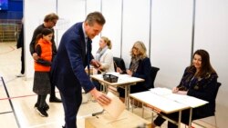 Independent Party candidate Bjarni Benediktsson casts his ballot at a polling station, in Gardabae, Iceland, Sept. 25, 2021. Icelanders were voting in a general election dominated by climate change.