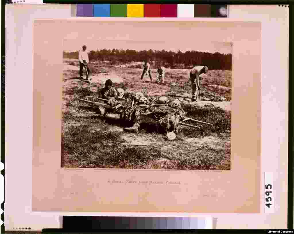 A burial party on the battle-field of Cold Harbor. (Photo by Alexander Gardner) 