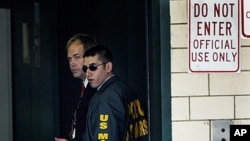 John Hinckley, left, at Federal Court in Washington, Sept. 2003 (file photo).