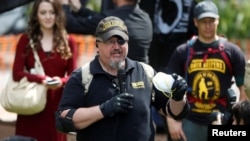 FILE - Oath Keepers founder Stewart Rhodes speaks during the Patriots Day Free Speech Rally in Berkeley, Calif., April 15, 2017.