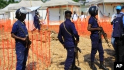 Police officers stand guards at a newly established Ebola response center in Beni, Democratic Republic of Congo, Aug. 10, 2018. 