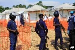 Police officers stand guard at a newly established Ebola response center in Beni, Democratic Republic of Congo, Aug. 10, 2018.