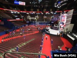 Workers finish last-minute preparations at the Quicken Loans Arena on Sunday, the day before the start of the Republican National Convention, July 17, 2016.