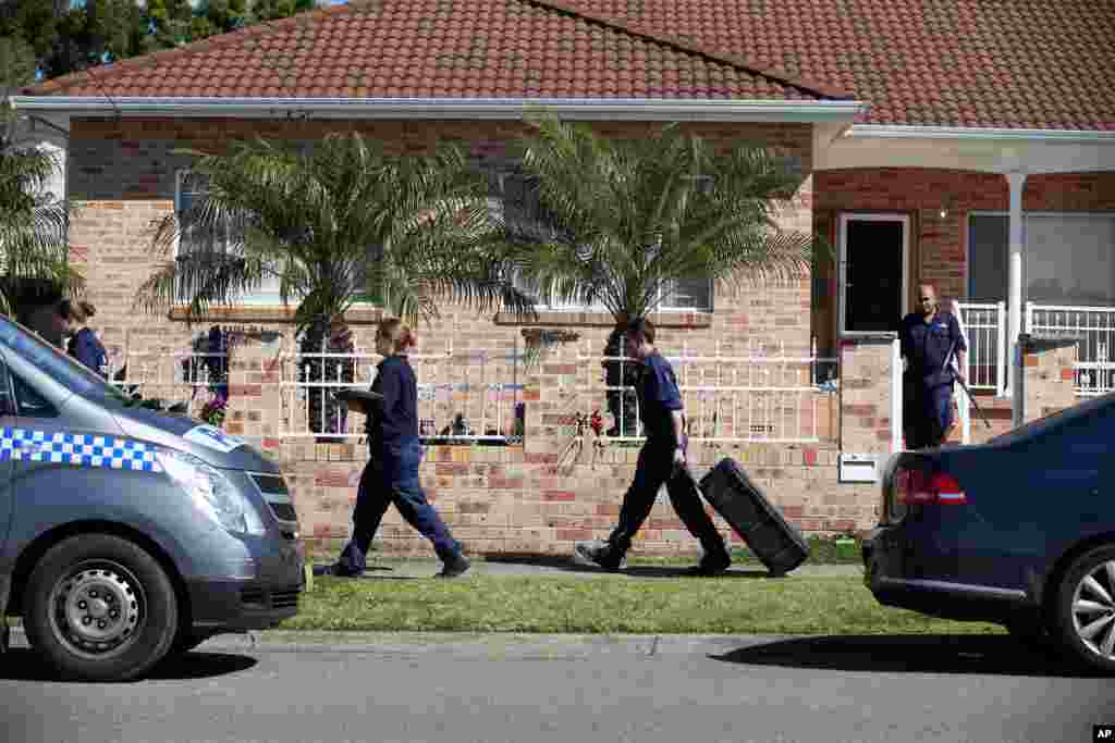 Police investigators search a home after about 800 federal and state police officers raided more than two dozen properties as part of an anti-terror operation,&nbsp;at Guildford in suburban Sydney, Australia, Sept. 18, 2014. 