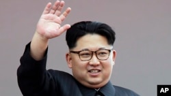 FILE - North Korean leader Kim Jong Un waves at parade participants at the Kim Il Sung Square in Pyongyang, North Korea, May 10, 2016