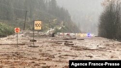 This handout photo taken and released on Nov. 14, 2021 by the British Columbia Ministry of Transportation and Safety shows a mudslide closing Highway 1 between Popkum and Hope, east of Chilliwack, Canada. 