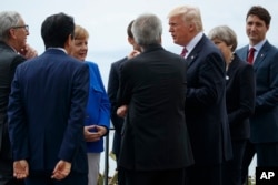 President Donald Trump poses for photos with G7 leaders at the Ancient Greek Theater of Taormina during the G7 Summit, May 26, 2017, in Taormina, Italy.