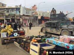 The scene directly outside the My Beautiful Lady restaurant three weeks before the bombing when the neighborhood was suddenly coming back to life in Mosul, Iraq, Jan. 21, 2017.