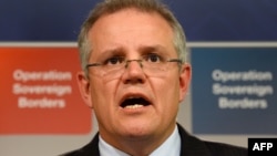 FILE - Australian Immigration Minister Scott Morrison speaks during a press conference in Sydney.