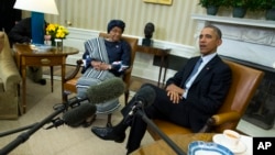 FILE - President Barack Obama meets with Liberian President Ellen Johnson Sirleaf to discuss the ongoing response to the Ebola outbreak in Western Africa and Liberia's recovery from the deadly virus, in the White House Oval Office in Washington, Feb. 27, 2015.
