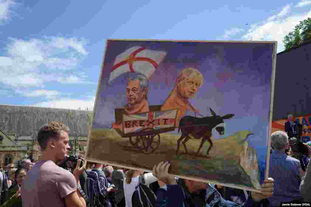 Many at Saturday’s pro-European Union march carried banners mocking former London Mayor Boris Johnson and Nigel Farage, the head of the United Kingdom Independence Party, July 2, 2016.