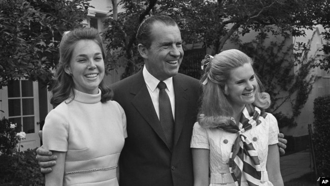 FILE - Richard Nixon with daughters