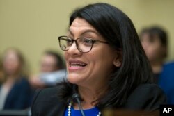 FILE - Rep. Rashida Tlaib, D-Mich., questions Michael Cohen, President Donald Trump's former lawyer, as he testifies before the House Oversight and Reform Committee, on Capitol Hill, Feb. 27, 2019, in Washington.