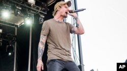 FILE - Kyle Pavone of We Came As Romans performs at the Rock On The Range Music Festival in Columbus, Ohio. 