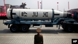 In this April 15, 2017 photo, a missile is paraded across Kim Il Sung Square during a military parade, in Pyongyang, North Korea.