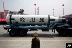 FILE - A submarine missile is paraded across Kim Il Sung Square during a military parade, in Pyongyang, North Korea to celebrate the 105th birth anniversary of Kim Il Sung, the country's late founder.