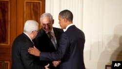 President Barack Obama talks with Palestinian President Mahmoud Abbas and Prime Minister Benjamin Netanyahu of Israel at the conclusion of a statement to the press in the East Room of the White House, Sept. 1, 2010.