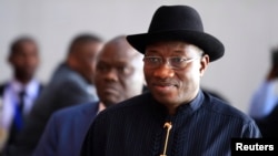 Nigeria's President Goodluck Jonathan arrives for the extraordinary session of the African Union's Assembly of Heads of State and Government on the case of African Relationship with the International Criminal Court (ICC), in Ethiopia's capital Addis Ababa