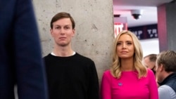 FILE - White House senior adviser Jared Kushner, left, and White House press secretary Kayleigh McEnany listen as President Donald Trump speaks at the Trump campaign headquarters on Election Day, Nov. 3, 2020, in Arlington, Va.