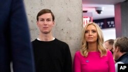 FILE - White House senior adviser Jared Kushner, left, and White House press secretary Kayleigh McEnany listen as President Donald Trump speaks at the Trump campaign headquarters on Election Day, Nov. 3, 2020, in Arlington, Va.