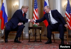 U.S. President Donald Trump and Russia's President Vladimir Putin shake hands as they meet in Helsinki, Finland, July 16, 2018.