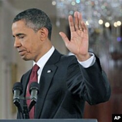 President Barack Obama waves as he turns to leave after a news conference in the East Room of the White House, 03 Nov 2010
