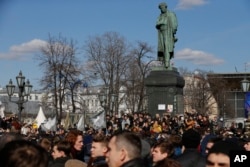 People gather outside Alexander Pushkin monument in downtown Moscow, March 26, 2017.