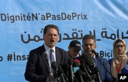 FILE - UNRWA’s Commissioner General Pierre Kraehenbuehl, left, gives a press conference to launch a global campaign to support UNRWA, at the UNRWA Rimal Girls Preparatory School in Gaza City, Jan. 22, 2018.