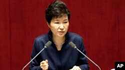 FILE - South Korean President Park Geun-hye delivers a speech at the National Assembly in Seoul, South Korea, following North Korea's recent nuclear test and long-range rocket launch. 