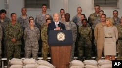 U.S. Vice President Joe Biden talks to U.S. military personnel at Al-Dhafra Air Base near Abu Dhabi, United Arab Emirates, Monday, March 7, 2016.