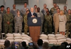 U.S. Vice President Joe Biden talks to U.S. military personnel at Al-Dhafra Air Base near Abu Dhabi, United Arab Emirates, March 7, 2016.