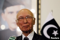 FILE - Adviser to Pakistan's Prime Minister on National Security and Foreign Affairs Sartaj Aziz listens to a question during a news conference with Iranian Foreign Minister Javad Zarif at the Foreign Ministry in Islamabad, April 8, 2015.