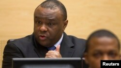Jean-Pierre Bemba, a former vice president of the Democratic Republic of Congo, speaks at the opening of his trial in The Hague, Nov. 22, 2010. 