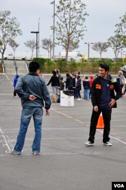 Volunteers discussing how to conduct games to students