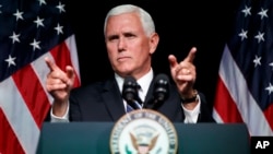 FILE - Vice President Mike Pence gestures during an event on the creation of a U. S. Space Force, Aug. 9, 2018, at the Pentagon. 