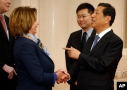 FILE - U.S. House Minority Leader Nancy Pelosi of Calif., left, speaks with with Zhang Ping, vice chairman of China's National People's Congress, as she arrives for a bilateral meeting at the Great Hall of the People in Beijing, Nov. 12, 2015.