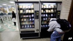 A student buys snacks from one of the vending machines at Lane Tech High School Thursday, Dec. 15, 2005, in Chicago. While the Chicago Public Schools have had a ban on junk food in place for some time, Illinois Gov. Rod Blagojevich now wants a statewide 