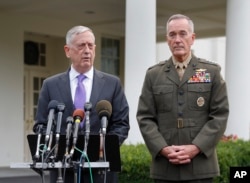 FILE - Defense Secretary Jim Mattis, left, accompanied by Joint Chiefs Chairman Gen. Joseph Dunford, right, speaks to members of the media outside the West Wing of the White House in Washington, Sunday, Sept. 3, 2017, regarding the escalating crisis in North Kor
